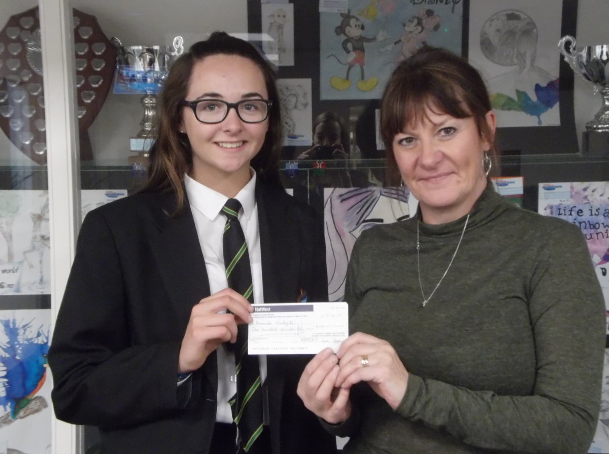 Image of The PTFA donates a cheque to contribute to fundraising for children in Nepal 